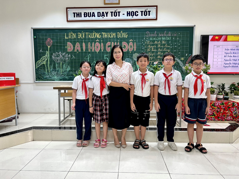 A picture containing text, person, standing, posing

Description automatically generated