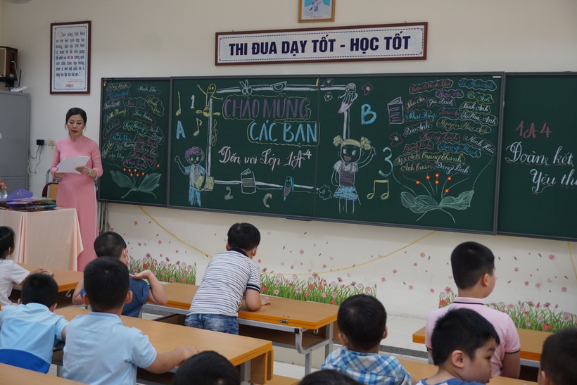 A teacher teaching a class
Description automatically generated with low confidence