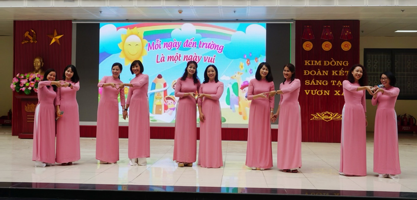 A group of women in dresses on a stage
Description automatically generated with medium confidence