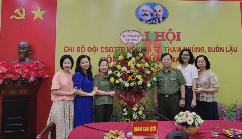 A group of people posing for a photoDescription automatically generated