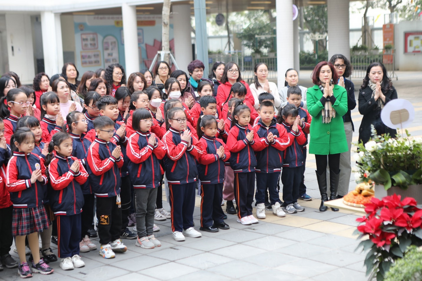 A picture containing person, group, posing, child

Description automatically generated