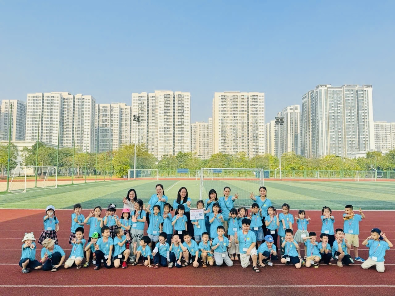 A group of people posing for a photo
Description automatically generated