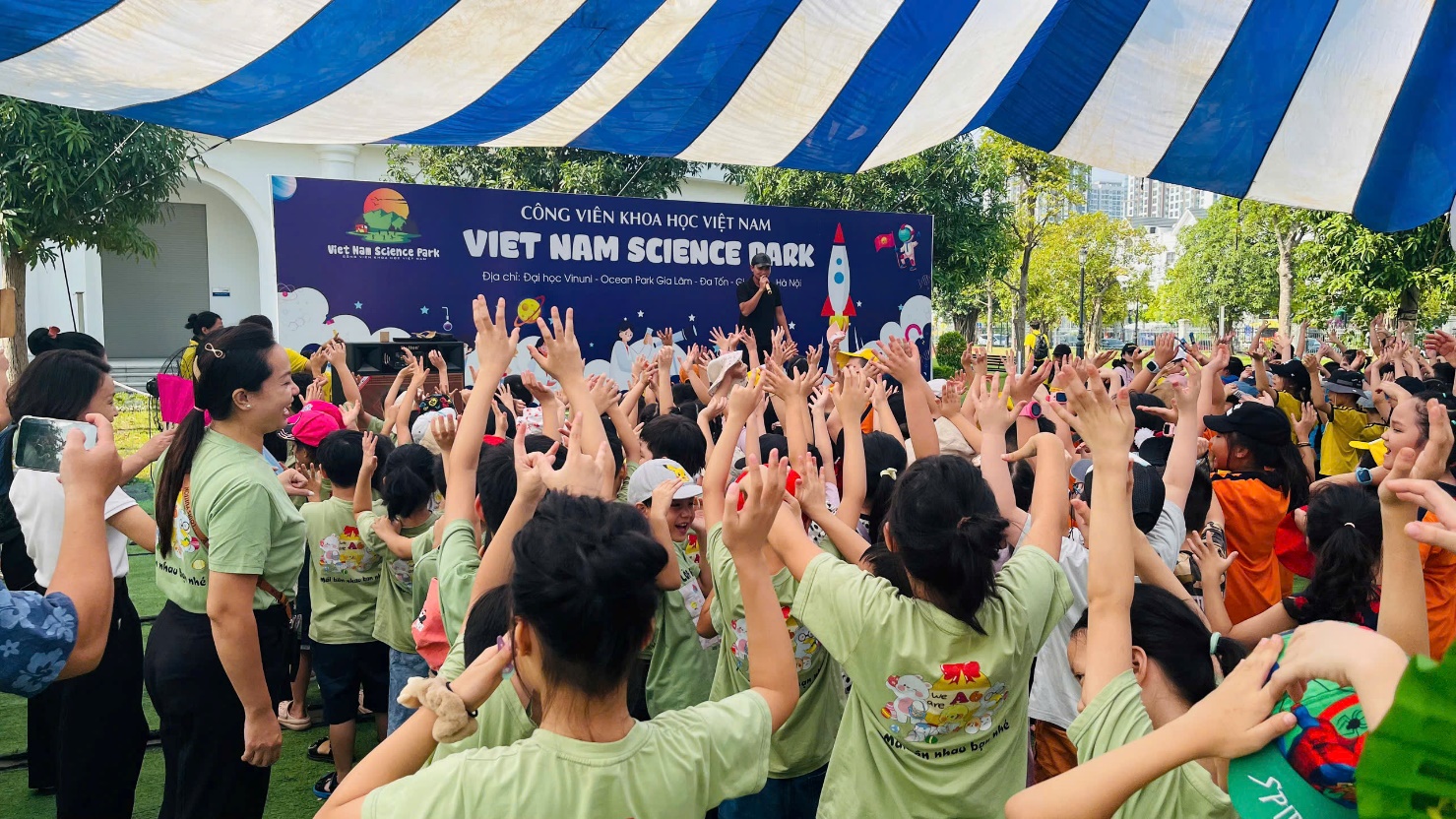 A group of people raising their hands
Description automatically generated