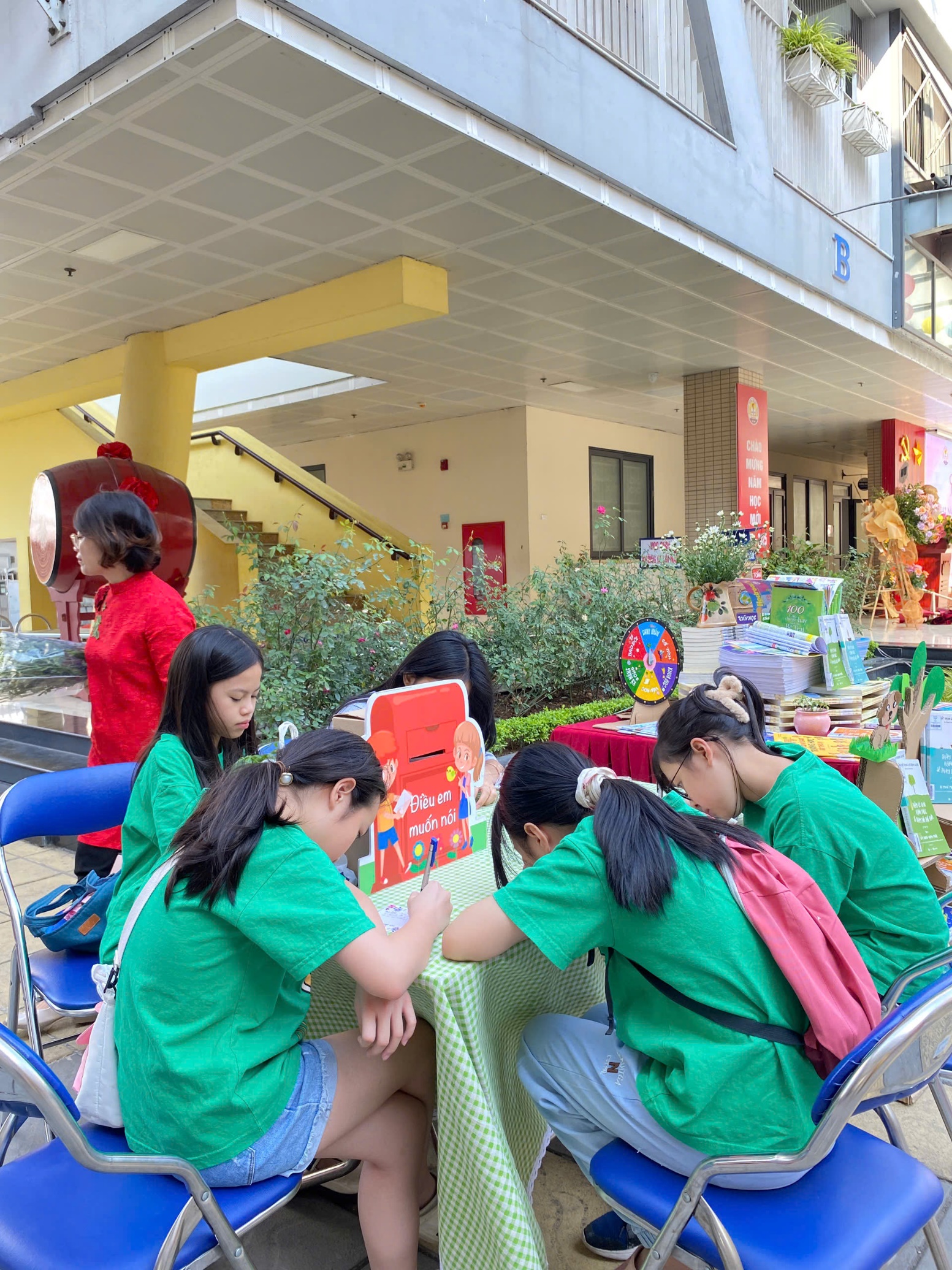 A group of girls sitting at a tableDescription automatically generated