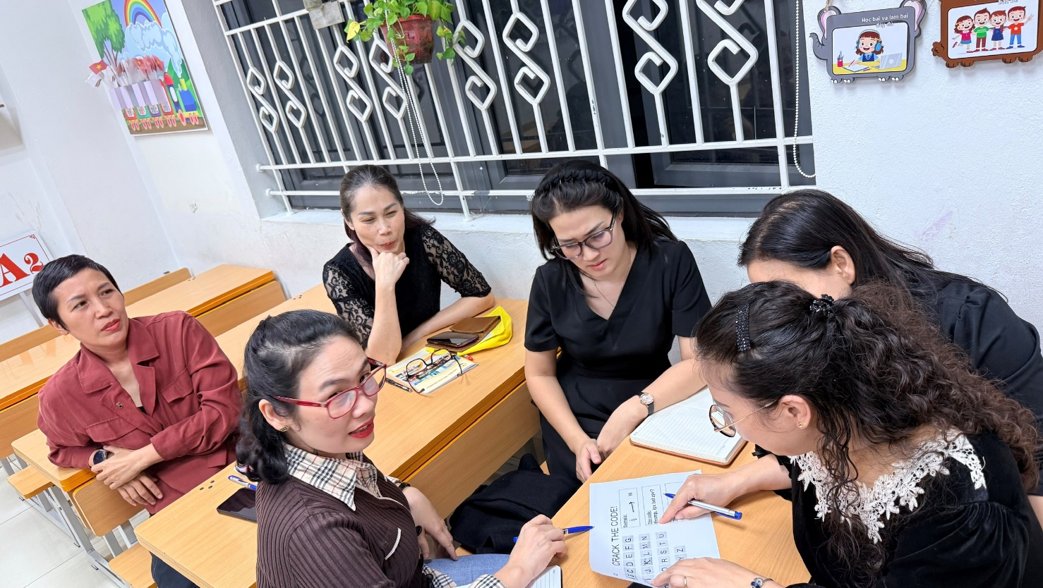 A group of women sitting around a table
AI-generated content may be incorrect.
