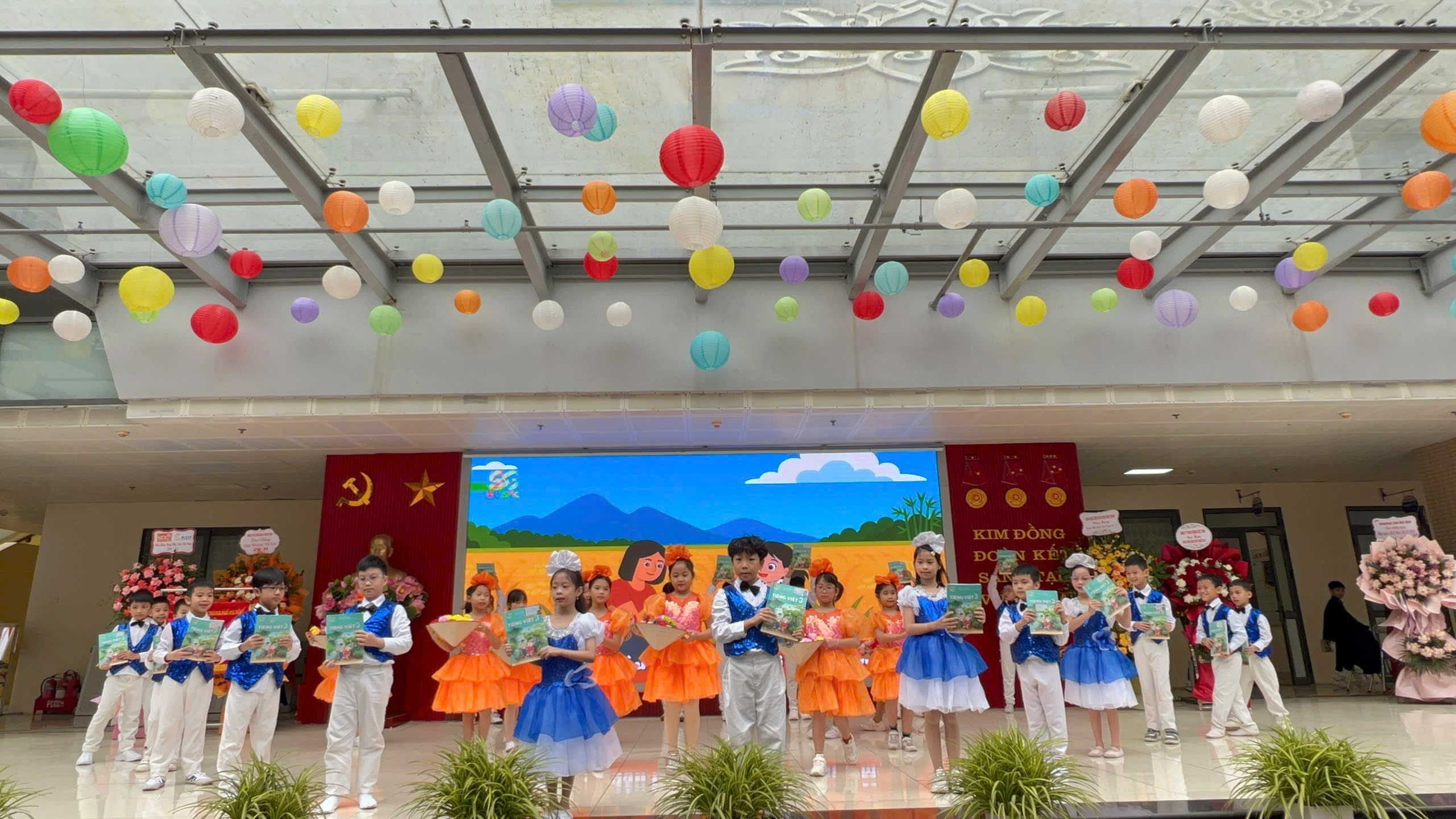 A group of children performing on a stage
AI-generated content may be incorrect.