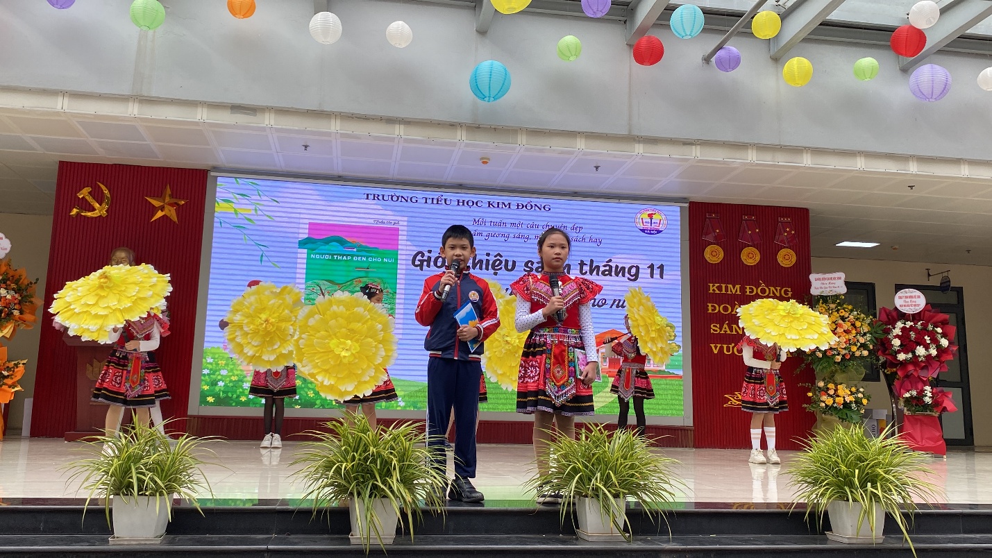 A group of children on a stage
Description automatically generated