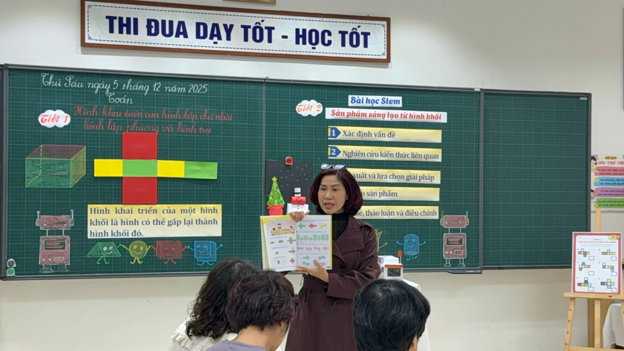 A person holding a piece of paper in front of a group of people
AI-generated content may be incorrect.