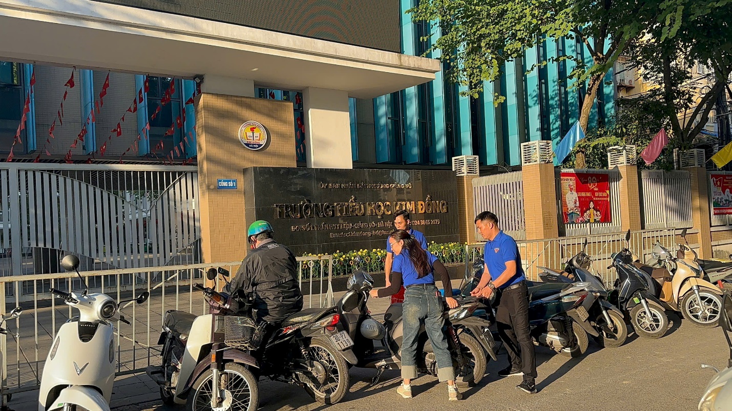 A group of people on motorcycles outside a building
Description automatically generated