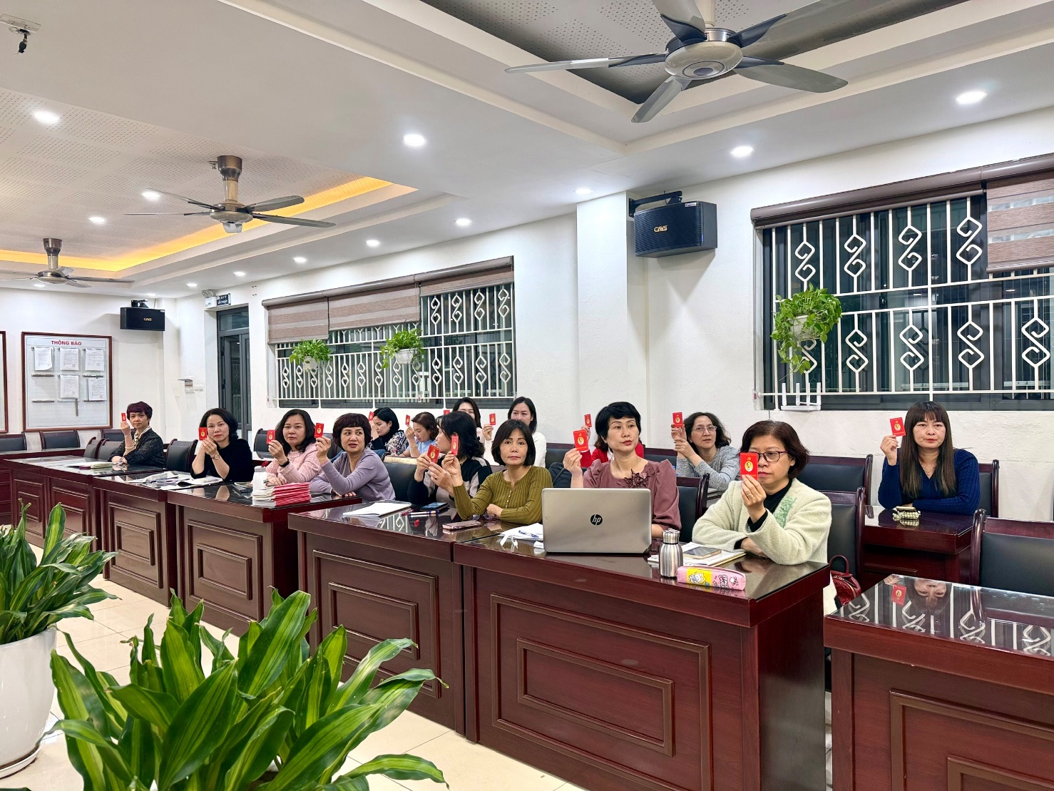 A group of people sitting at desks in a room
AI-generated content may be incorrect.