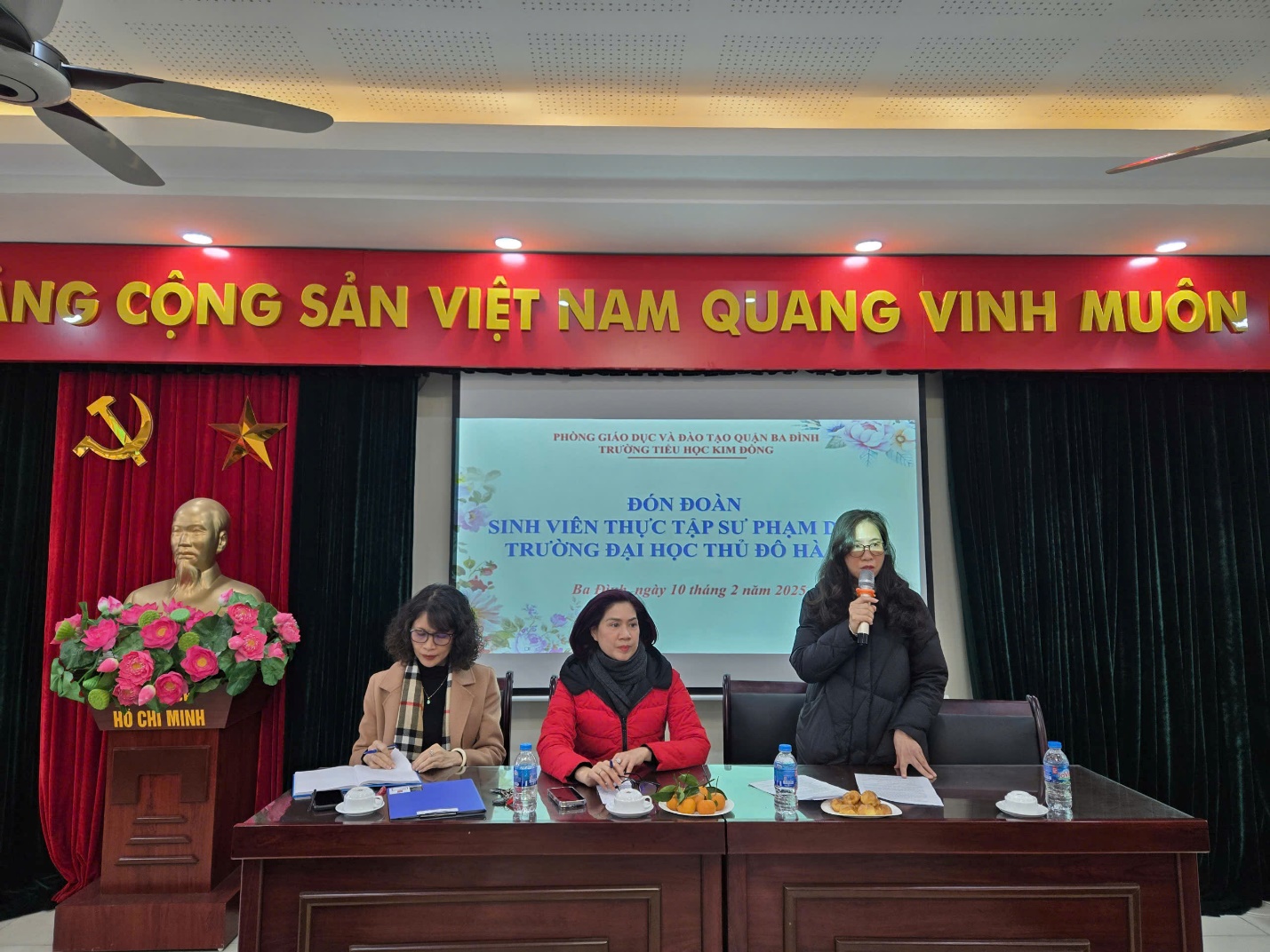 A group of women sitting at a podiumDescription automatically generated