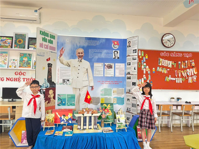 A child and child standing in front of a displayDescription automatically generated