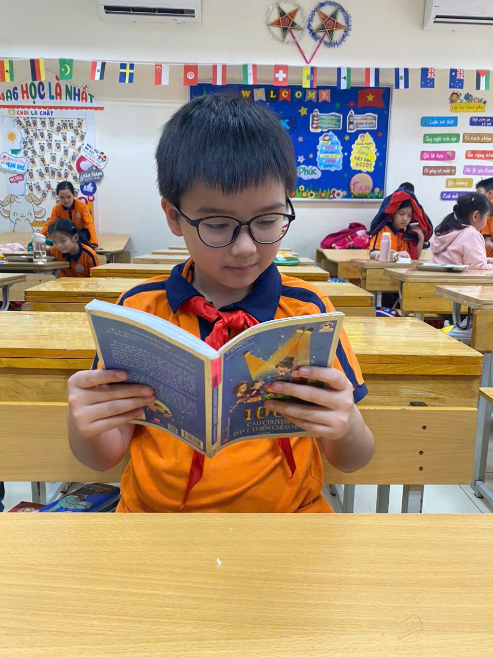 A child reading a book in a classroom

AI-generated content may be incorrect.