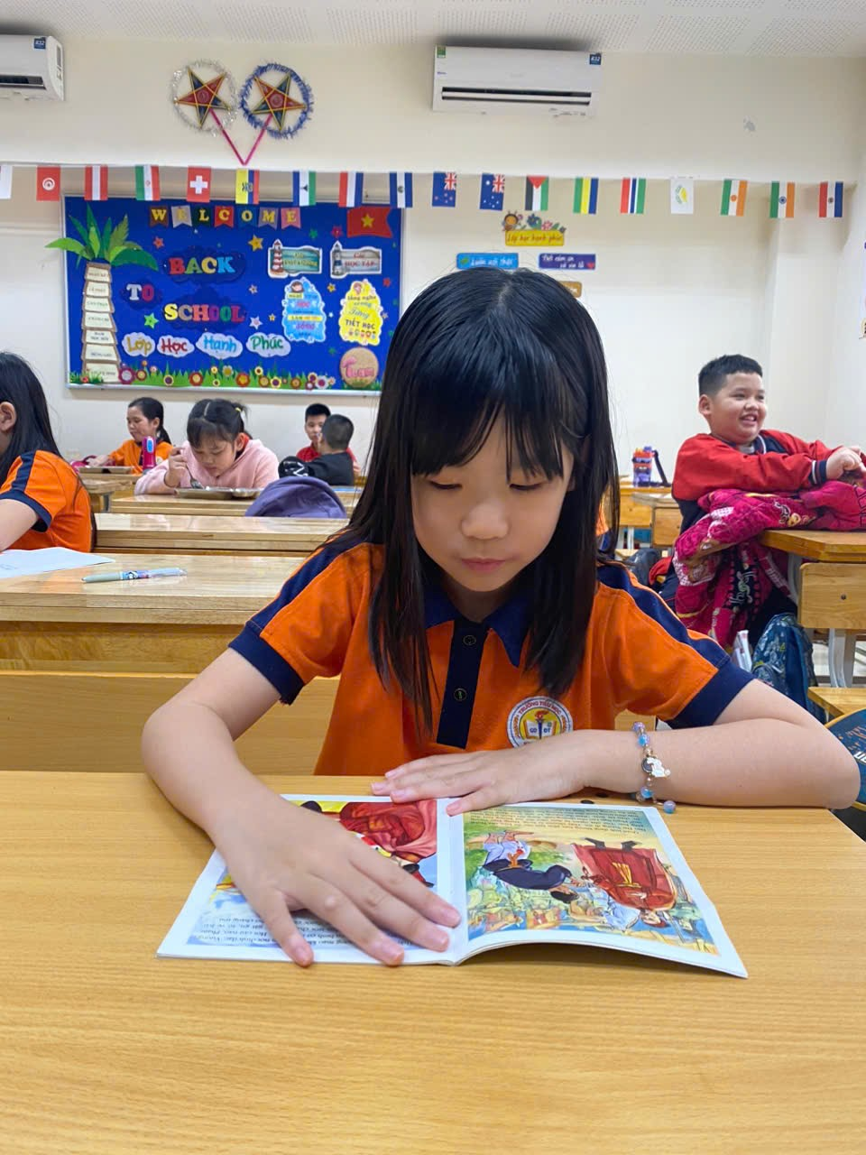 A child reading a book in a classroom

AI-generated content may be incorrect.