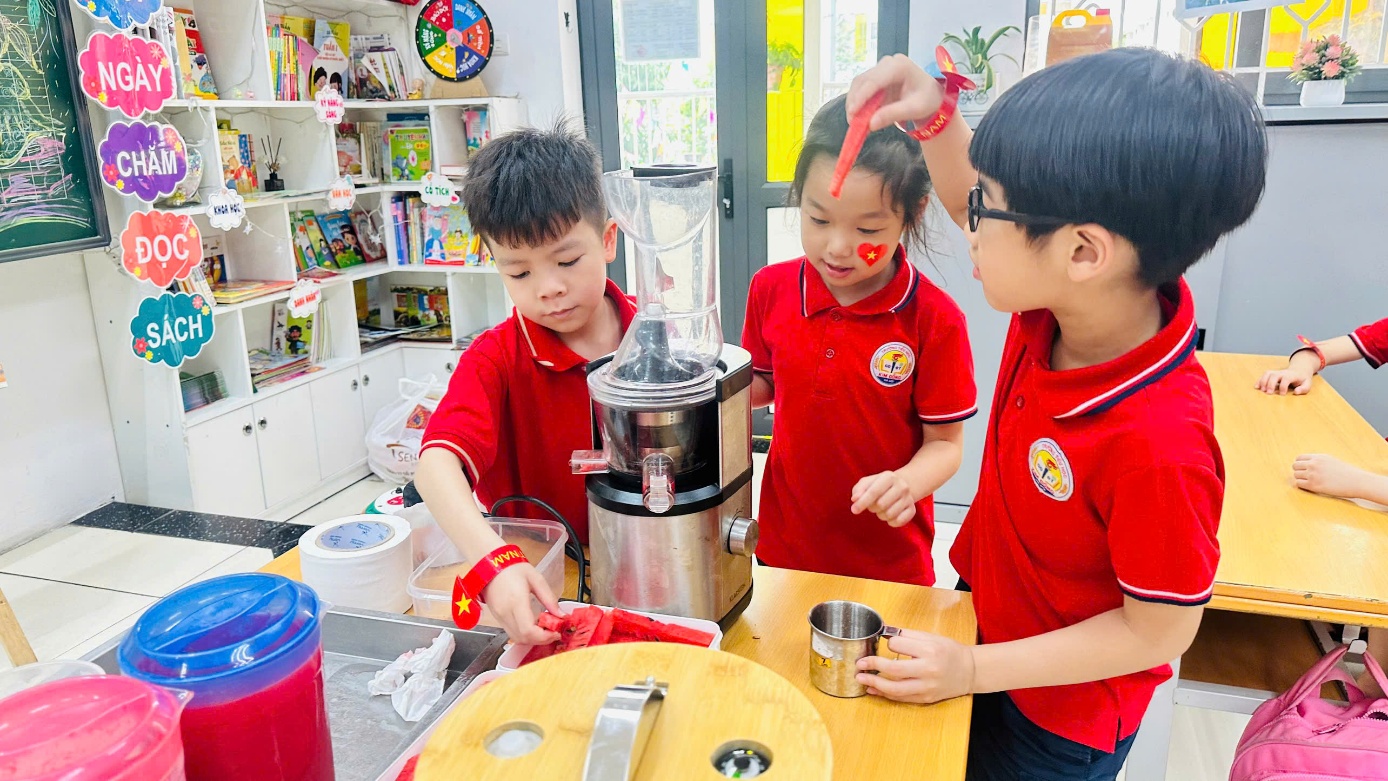 A group of kids in red shirts
Description automatically generated