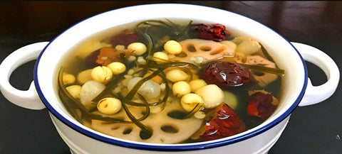A bowl of soup with vegetables
AI-generated content may be incorrect.