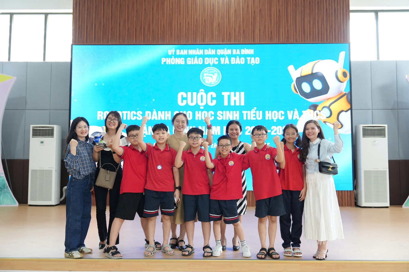 A group of people posing for a photoAI-generated content may be incorrect.