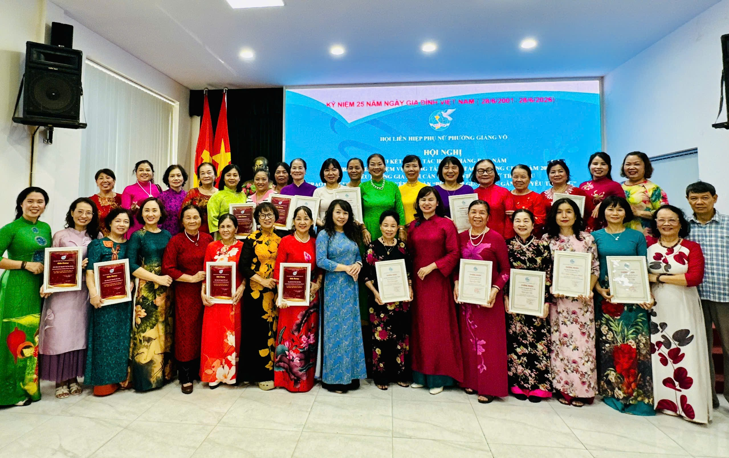A group of women holding certificates

Description automatically generated