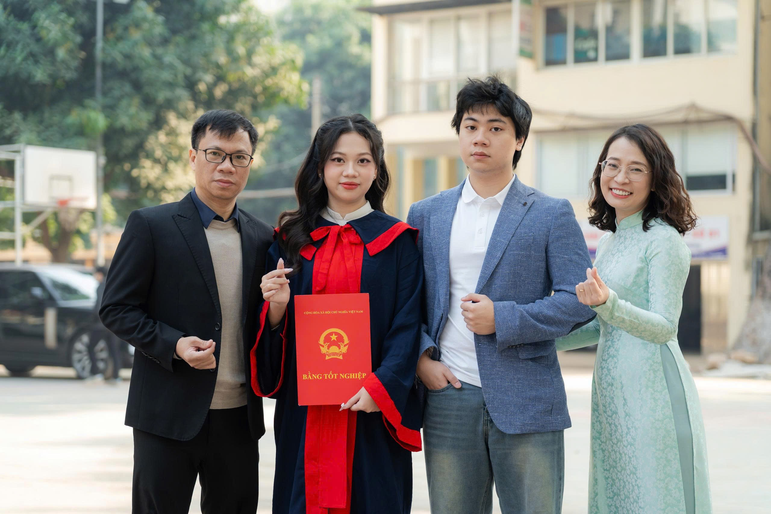 A group of people posing for a photo

Description automatically generated