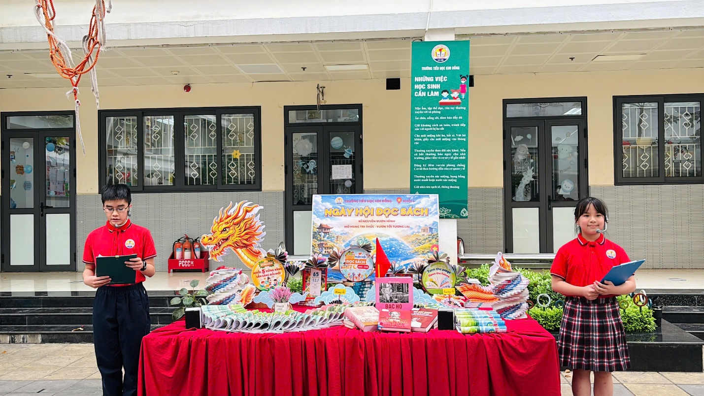 A table with red cloth and a sign

Description automatically generated